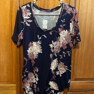 Brand New!! W/Tags Maurice’s Navy Blue shirt with light pink, purple flowers.